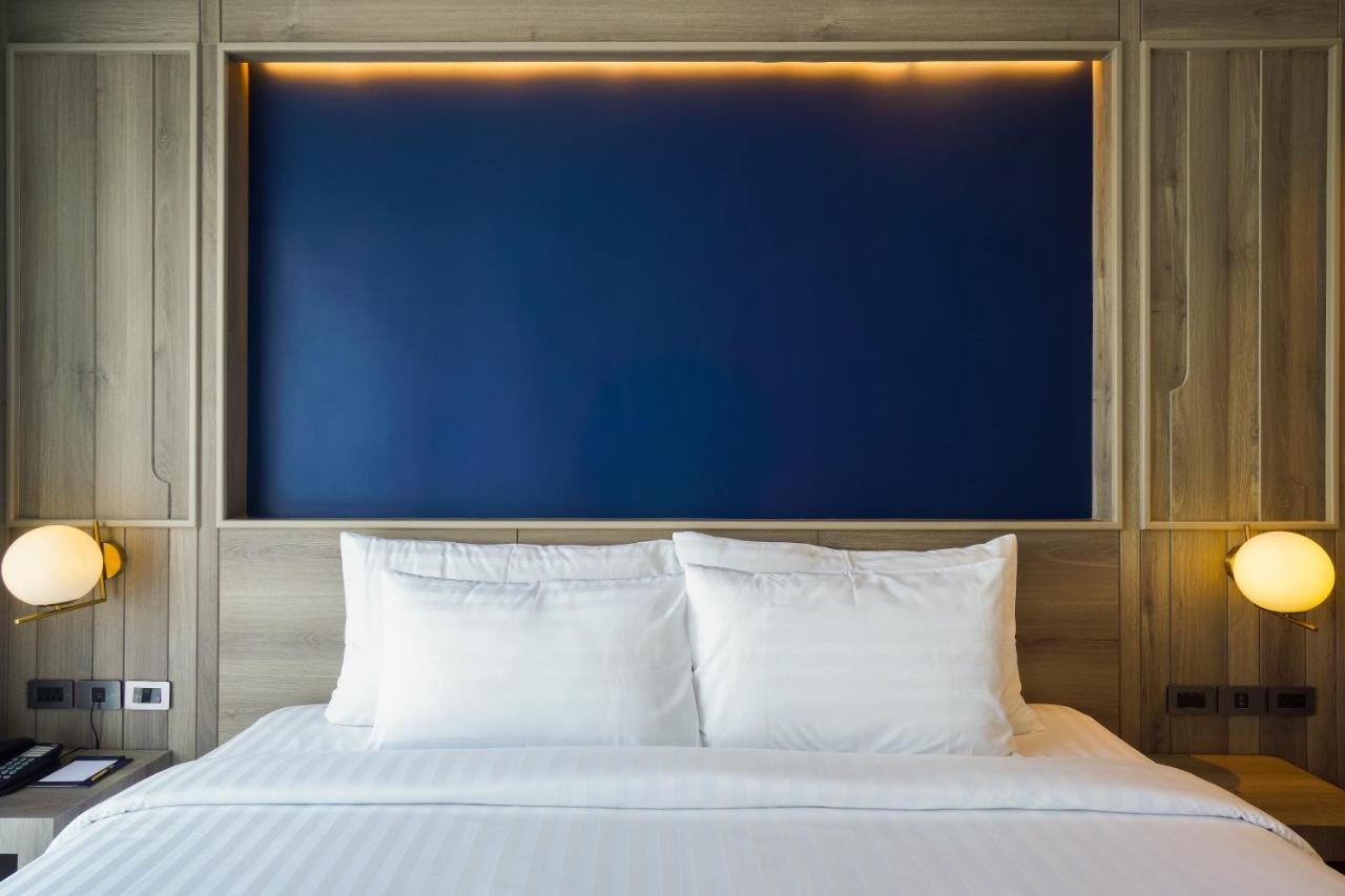 Seabed Grand Hotel Phuket - Sha Extra Plus Esterno foto A bed with two pillows